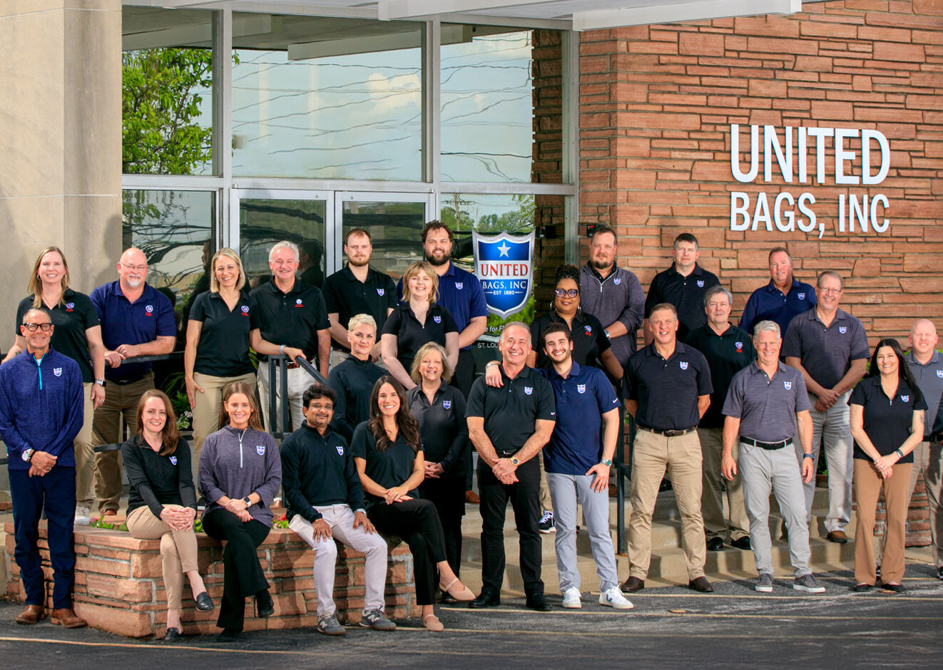 United Bags employees collaborating in the warehouse and office environment